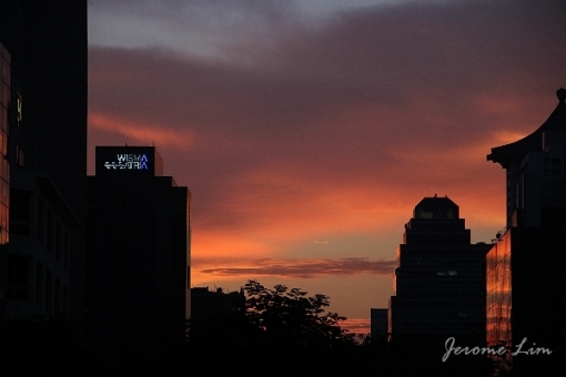The sun sets on Orchard Road on 29 July 2010.