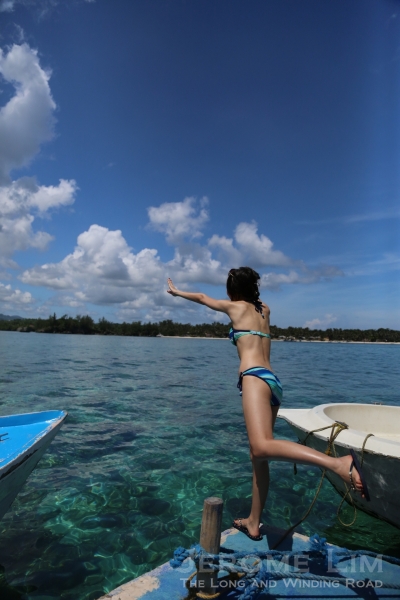 Christina jumping into the inviting crystal clear blue waters.