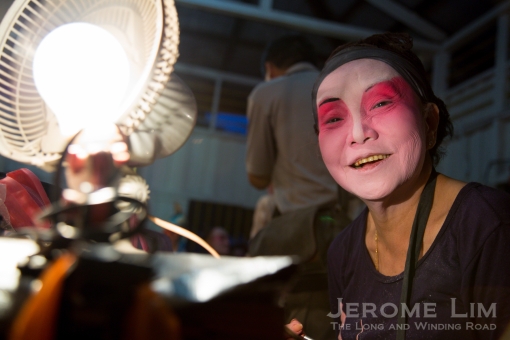 Backstage at the wayang stage: a festive face of Ubin.