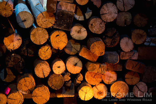 Wood for firing in the glow of the kiln.